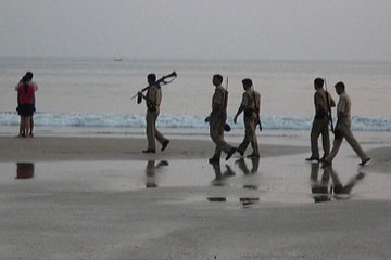 Police patrol an Indian beach