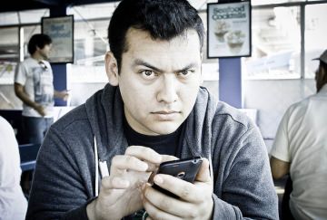 Angry person using cellphone