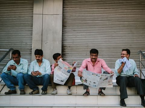 Indians engaged in catching up with the news