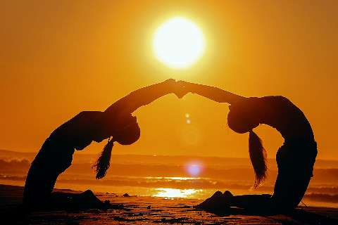 Yoga with a friend helps to attain goals