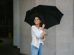 happy-woman-holding-umbrella